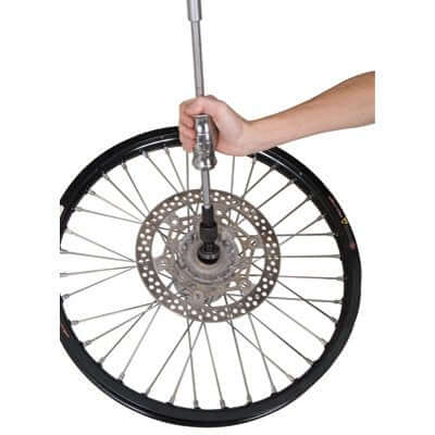 Blind Hole Bearing Puller Kit With Slide Hammer And Collets, 8mm Through 30mm, demonstrated on a bicycle wheel hub for bearing removal.