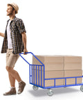 Person moving a cart loaded with boxes using 5 Inch Heavy Duty Industrial Cast Iron Swivel Casters Set Of 4, 2000 Lb Capacity