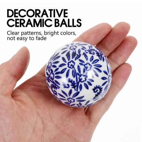 Hand holding one blue-patterned porcelain ball from 3Pcs Porcelain Balls Ceramic Balls Decorative Orbs Decorative for Centerpiece Small Spheres Floating for Bowl Vase Filler Fish Tank Pool Decor Vintage Home Decor.