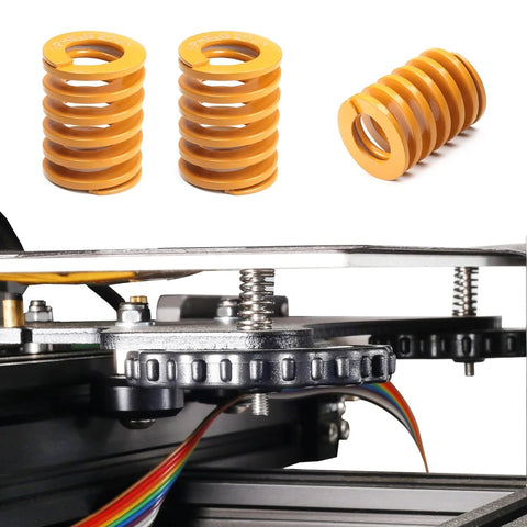 Three yellow compression springs and one installed on a 3D printer, similar to Five Pack 3D Printer Bed Springs 20mm OD 10mm ID 25mm Length Compression Mould Die Springs Light Load Blue For Mechanical Equipment DIY Projects And 3D Printer Accessories Tayffency.