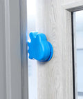 Anti Slam Door Safety For Kids Two Pack Finger Trap Stoppers With Adhesive Pad, blue plastic guard installed on door handle.