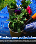 Blue 2 Pack Plastic Pallets With Breathable Grid Ventilation For Easy Storage In Supermarkets, Warehouses, Garages, And Basements Lightweight Waterproof And Wear Resistant 23.6 X 11.8 X 1.2 Inches holding potted plants on a lawn.