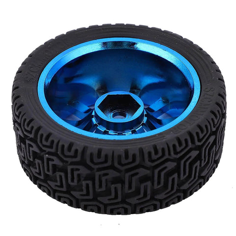 Close-up of a black rubber tire with a blue metallic center hub for robotics or model vehicles.