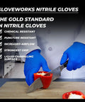 Person wearing Royal Blue Nitrile Gloves 6 Mil Latex Free Raised Diamond Texture Medium while slicing a red pepper