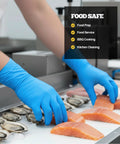 Blue 6 Mil Heavy Duty Nitrile Gloves Textured Powder Free Latex Free Box Of 100 worn by person handling salmon and oysters