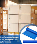 Adjustable Cargo Pallet Straps Bundle For Shipping And Storage Reusable Pallet Wrap Ties 19.3 Inch Wide By 15 Foot Long Bright Blue Oxford Fabric Easy To Use Alternative To Stretch Film next to cardboard boxes