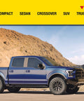 Blue truck parked in front of mountain landscape, highlighting the use of Aerosol Emergency Flat Tire Repair And Inflator For X Large Tires.