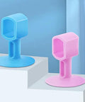 Blue and pink silicone door knob cushions on steps, similar to soft silicone door knob cushions absorb impact and reduce wall noise.
