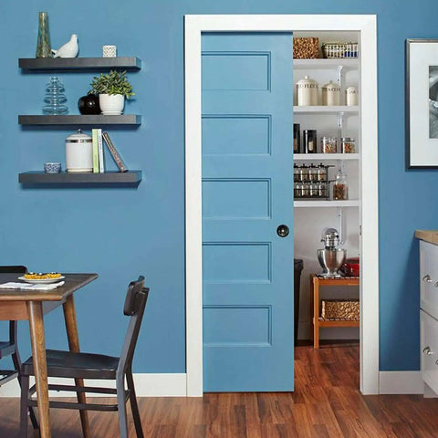Soft Close Pocket Door Frame Kit for 2x4 Stud Walls 32x80 Inches installed in a blue kitchen, showcasing smooth quiet closure.