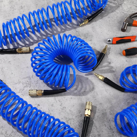 Six Pack 25 Foot Polyurethane Recoil Air Hose With One Quarter Inch Quick Connect And Plug Bend Restrictor Anti Twist Coil Line For Home Garage Or Workshop Blue on concrete floor with tools