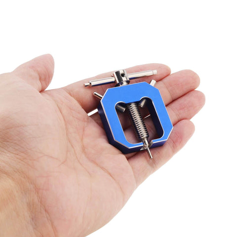 Hand holding blue RC Motor Pinion Gear Puller Set Universal Gear Puller Remover For Vehicle Models And Small Motors