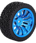 Side view of a blue and black rubber tire with patterned tread and a plastic hubcap for RC cars or robotic models.