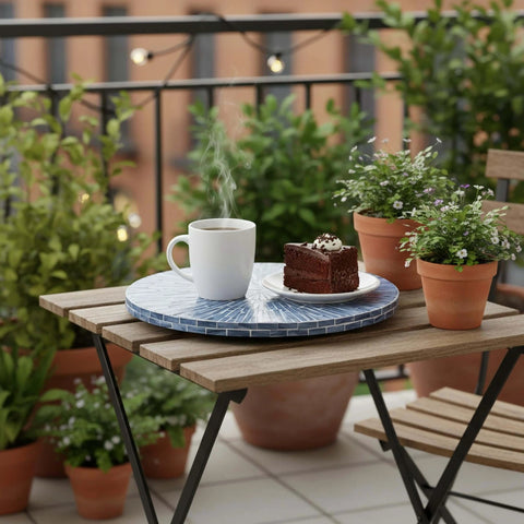 12.6 inch mother of pearl lazy susan turntable with blue starburst design, decorative rotating tray on a balcony table.