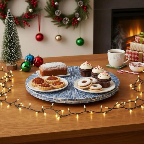12.6 inch mother of pearl lazy susan turntable with blue starburst design, decorative rotating tray hosting holiday treats.