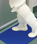 Person in lab attire stepping on blue sticky mat in cleanroom. Heavy Duty Sticky Mat Tacky Adhesive Pads 300 Sheets Bulk Pack