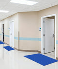 Blue Sticky Tacky Mat 24x36 Inches With 150 Sheets in cleanroom hallway for dust and dirt control at entry points.