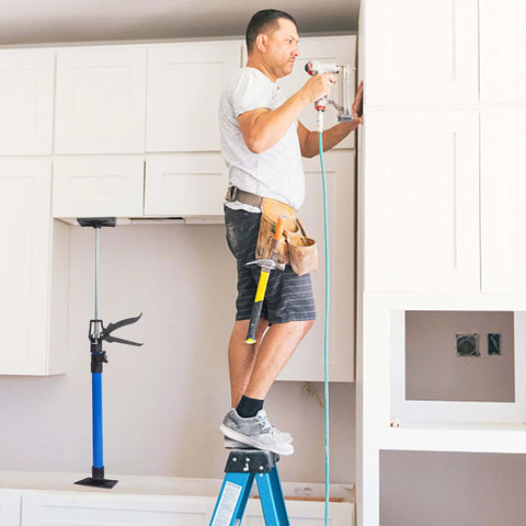 Installer using ✝️ Adjustable Support Pole, 3rd Hand Support System, Steel Support Rod for Cabinet Jacks Cargo Bars Drywall Support, Blue