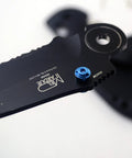 Close-up of a knife with blue thumb stud, featuring ZYAMY 3pcs Thumb Studs, Titanium Screws Replacement Thumb Studs Pocket Blade Screws for 535 Bugout