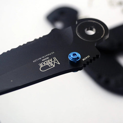 Close-up of a knife with blue thumb stud, featuring ZYAMY 3pcs Thumb Studs, Titanium Screws Replacement Thumb Studs Pocket Blade Screws for 535 Bugout