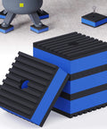 Industrial blue and black vibration isolation pads with textured surfaces used under machinery or equipment for stability and noise reduction.