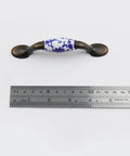 Blue White Porcelain Ceramic Cabinet Handles 4.96 Inch T Bar Pulls With Screws 76mm Center To Center shown with measuring ruler