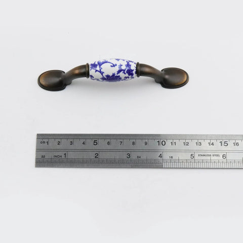 Blue White Porcelain Ceramic Cabinet Handles 4.96 Inch T Bar Pulls With Screws 76mm Center To Center shown with measuring ruler