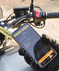 Rider using Bluetooth app to control Essentials Micro XSystem 3.0 Plus Electronic Automatic Motorcycle Chain Lubrication System