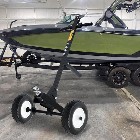 12 Inch Flat Free Solid Polyurethane Tire and Wheel on trailer dolly next to boat, black all-purpose replacement with 1 inch bore