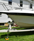 Durable Wheel Dock For Trailer Tongue Jack Heavy Duty Wheel Dock For Cargo Camper RV Boat Roller Stopper Caster Chock Easy To Store And Transport HOXWELL installed under boat trailer in yard.