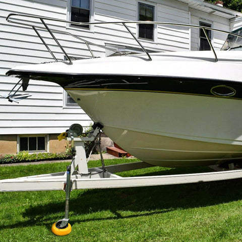 Durable Wheel Dock For Trailer Tongue Jack Heavy Duty Wheel Dock For Cargo Camper RV Boat Roller Stopper Caster Chock Easy To Store And Transport HOXWELL installed under boat trailer in yard.
