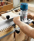 Carpenter using 1617EVSPK Combo Router With Plunge And Fixed Base, 2.25 HP Motor, 8,000 to 25,000 RPM, Quick Clamp Base Swap in workshop