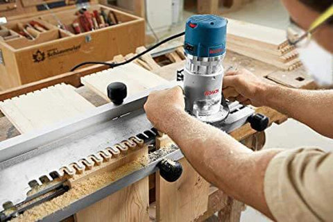 Carpenter using 1617EVSPK Combo Router With Plunge And Fixed Base, 2.25 HP Motor, 8,000 to 25,000 RPM, Quick Clamp Base Swap in workshop