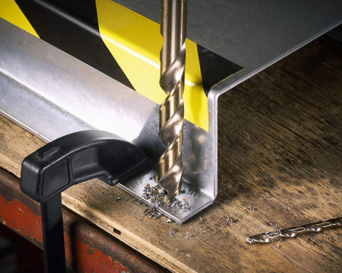 Bosch 14-Piece Cobalt M42 Drill Bit Set With Three-Flat Shank drilling into metal on workshop table