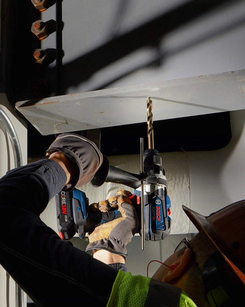 Person using Bosch 14-Piece Cobalt M42 Drill Bit Set With Three-Flat Shank for drilling metal beam