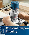 Person using Bosch 1617EVSPK Combo Router With Plunge And Fixed Base, 2.25 HP Motor, 8,000 to 25,000 RPM, Quick Clamp Base Swap