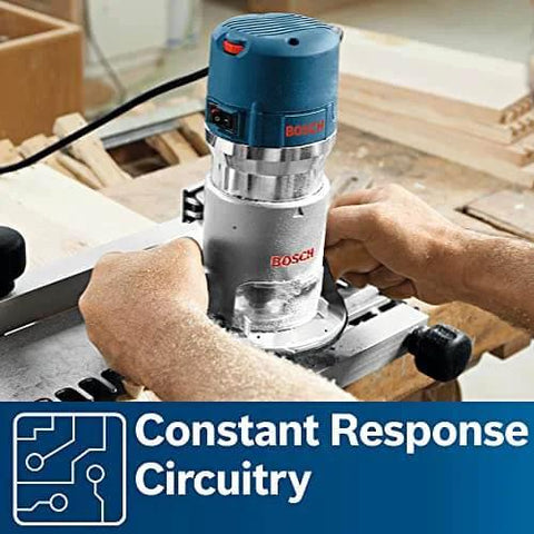Person using Bosch 1617EVSPK Combo Router With Plunge And Fixed Base, 2.25 HP Motor, 8,000 to 25,000 RPM, Quick Clamp Base Swap