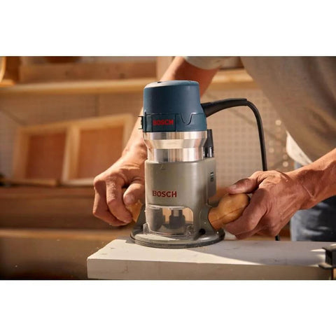Person using 1617EVSPK Combo Router With Plunge And Fixed Base, 2.25 HP Motor, for precise woodworking