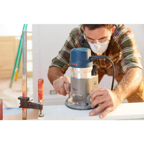 Woodworker using Bosch 1617EVSPK Combo Router With Plunge And Fixed Base, 2.25 HP Motor, 8,000 to 25,000 RPM, Quick Clamp Base Swap