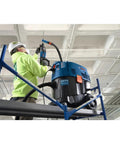 Worker using One And One Eighth Inch SDS-Plus Bulldog Xtreme Max Rotary Hammer For Concrete Drilling And Chiseling In Masonry on ceiling