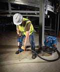 Worker using One And One Eighth Inch SDS-Plus Bulldog Xtreme Max Rotary Hammer For Concrete Drilling And Chiseling In Masonry
