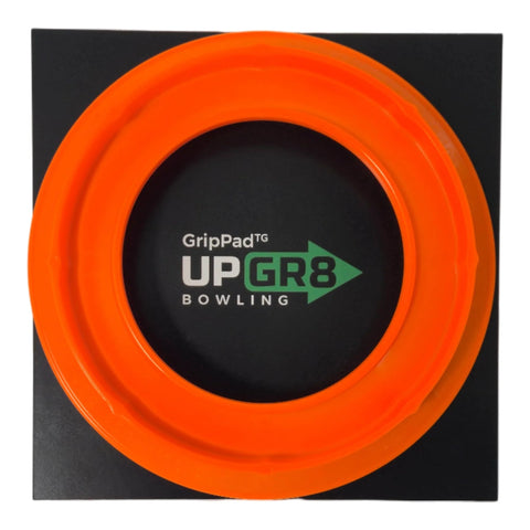 Top view of orange Bowling Ball Sanding Pad Holder for Surface Shaping and Consistent Reaction on black background.