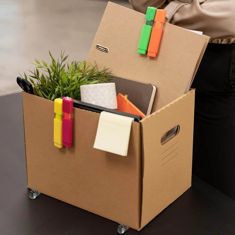 Cardboard box with 8Pcs 1/2 Inch Small Caster Wheels 360 Degree Swivel Casters, holding office supplies and a small plant