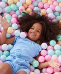 Child playing in BPA Free Crush-Proof Plastic Ball Pit Balls in 6 pastel colors