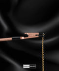 Bracelet Fastener Helper Tool With Hook For Bracelet Necklace Jewelry And Watch Clasp Clip Grab And Go Portable Easy To Use No Slip Grip Made Of Durable Metal With Rose Finish shown holding a chain.