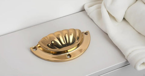 Brass Cup Handle With Elegant Scalloped Shell Design Pack Of 4 on cabinet surface, durable brass construction with smooth edges.