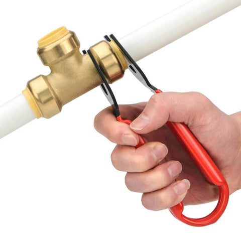 Hand using Disconnect Tong For Brass Push To Connect Fittings One Half Inch Three Quarter Inch And One Inch Removal Tool For Demount In Tight Spots