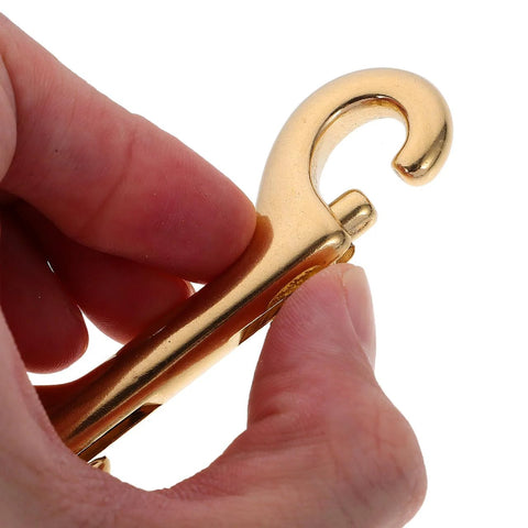 Close-up of hand holding one of the 4 Pack 3.5 Inch Brass Double Ended Bolt Snap Clips Heavy Duty for dog leashes and boating gear.