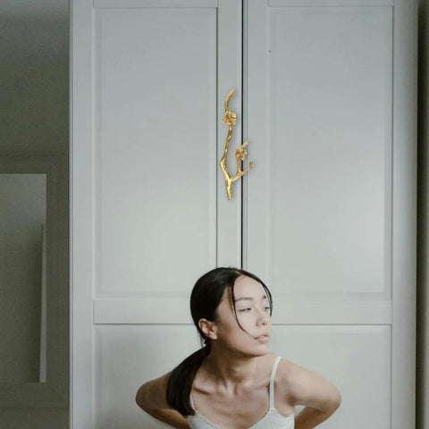 Brass Flower Branch Cabinet Handle 5.91 Inch Blossom Drawer Pull Knob on a white wardrobe in a vintage style home