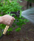 All Brass Garden Hose Quick Connect Fittings Three Quarter Inch GHT Easy Connect Male Only Eight Pack in use nozzle spraying water