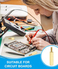 Person using 10 Pcs Brass Hex Spacer Screws M2.5 X 25mm And 6mm Brass Hex Standoffs on a circuit board.